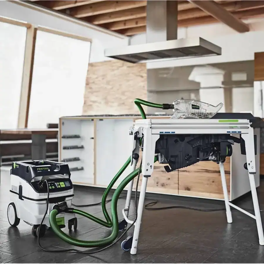 Festool TKS 80 EBS table saw on its legs with Festool dust extractor and hoses attached